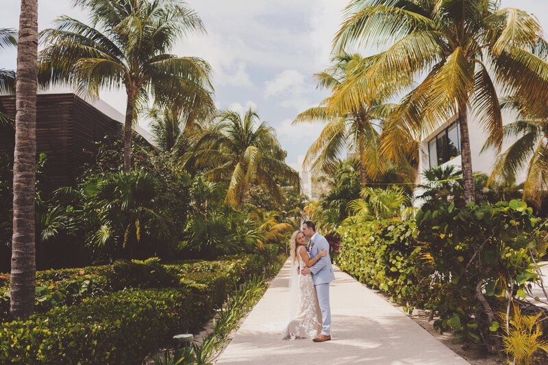 Cancun Wedding Photographer photograph of of bride and groom in the gardens at the Fines.