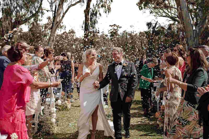 Bride and groom hugging each other.