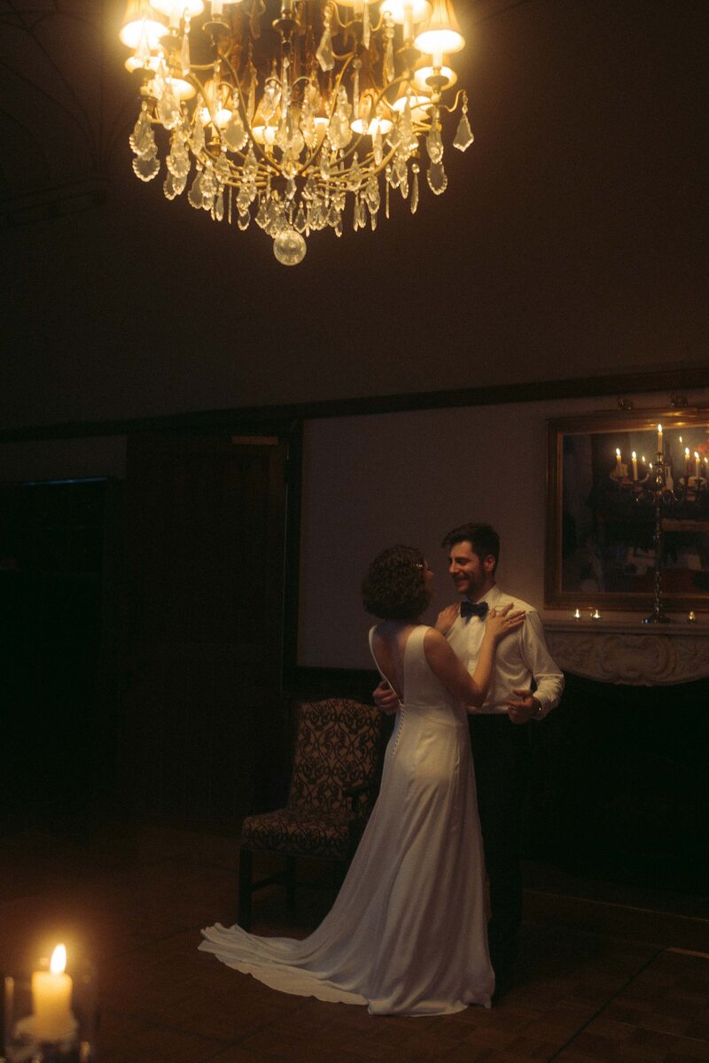 A romantic moment as the couple shares a slow dance, wrapped in love and elegance during their unforgettable wedding day