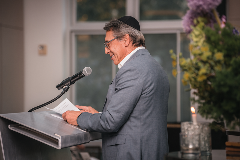 Speaker addressing guests at an Aspen event