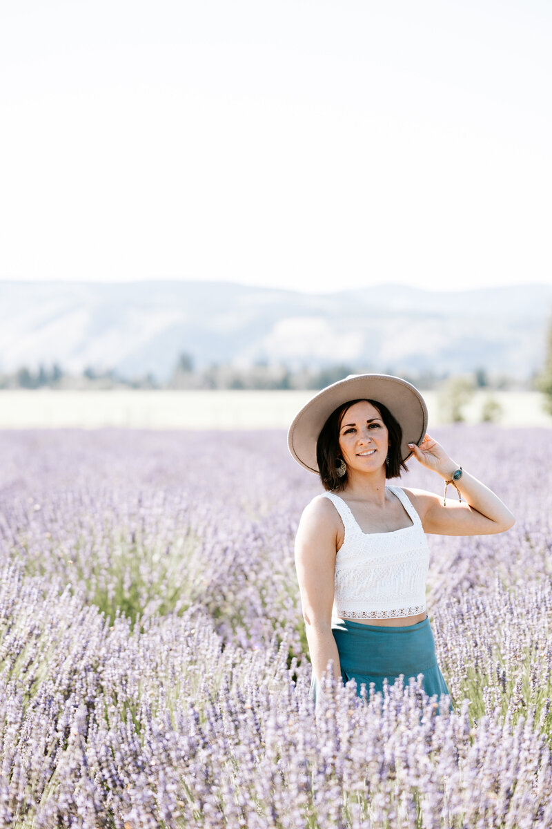 Headshot of Lois M Photography a San Antonio Photographer standing in a lavender field