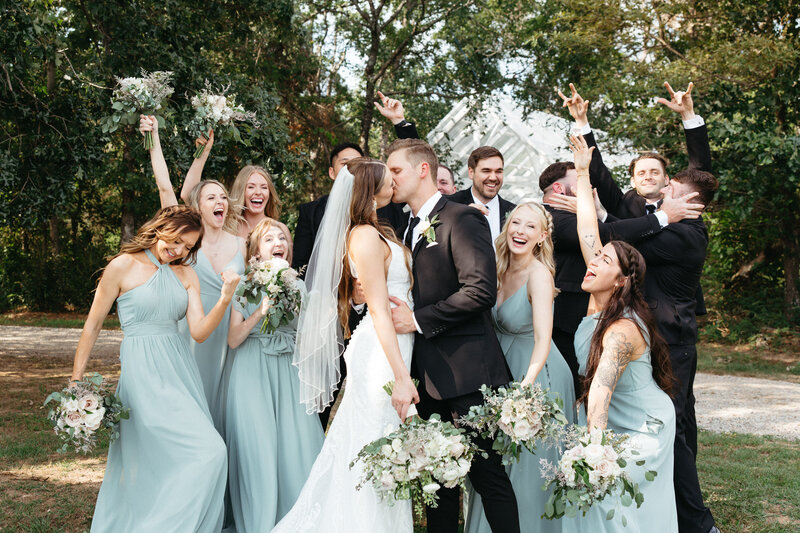 Wedding party celebrating summer wedding at kindered barn, arkansas weddings.