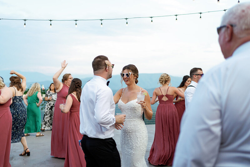 Bride and groom dancing with mountains in the background at The Trillium