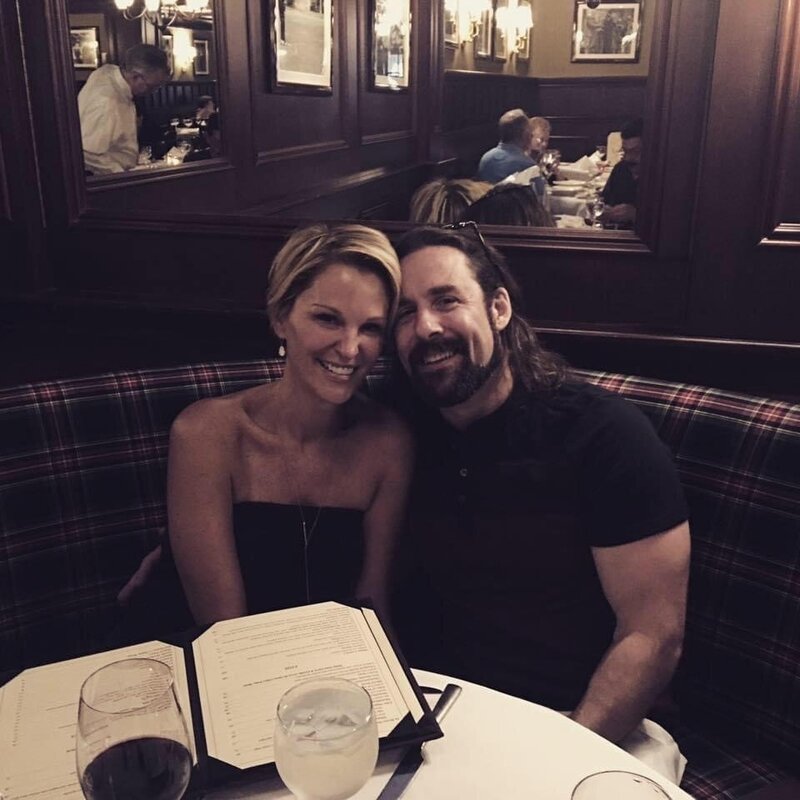Couple in plaid-lined booth having dinner at dimly lit restaurant in Long Beach, NY