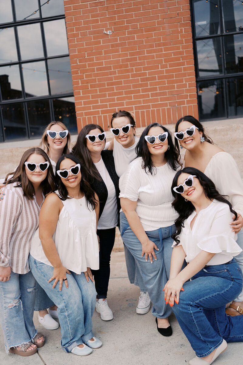 Wedding planners in Raleigh smiling with heart sunglasses