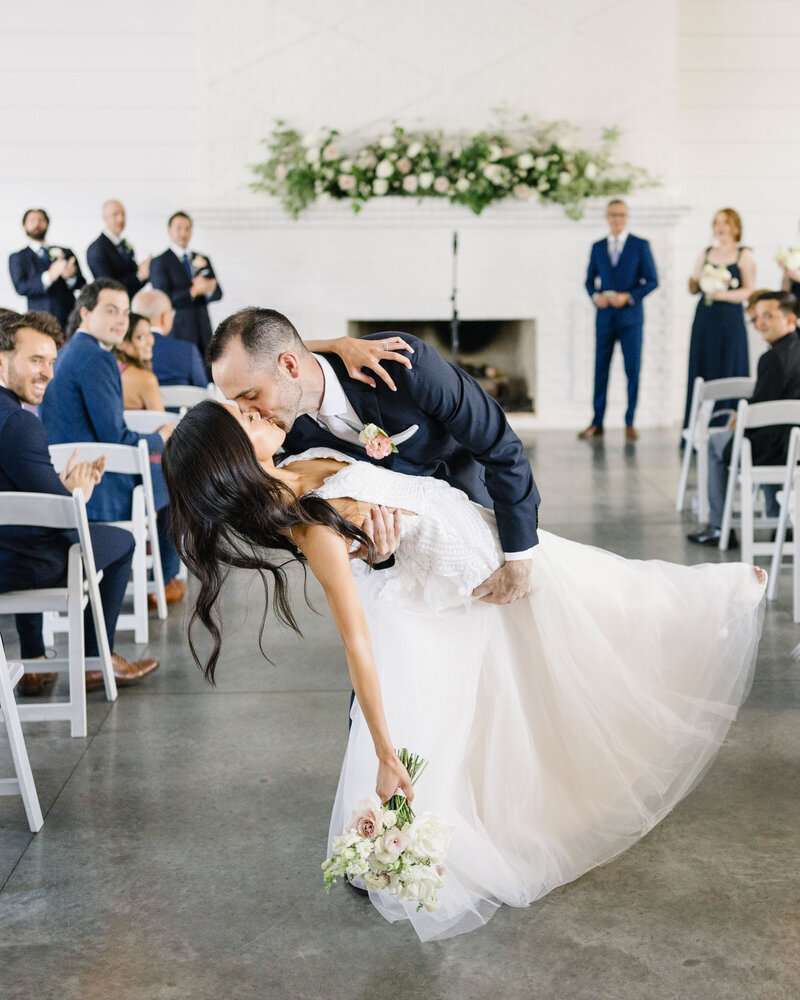 12 Hutton-House-Wedding-First-Kiss-in-Aisle