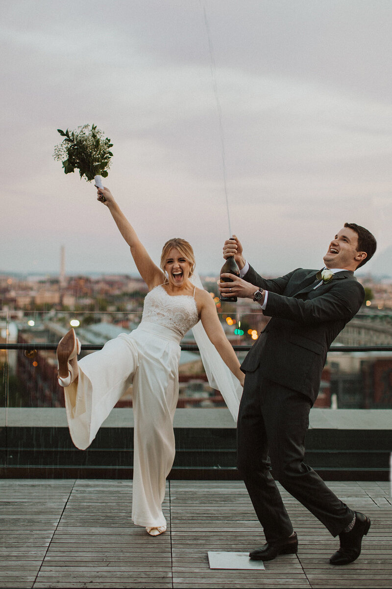 Couple Poses on Rooftop During DC Elopement