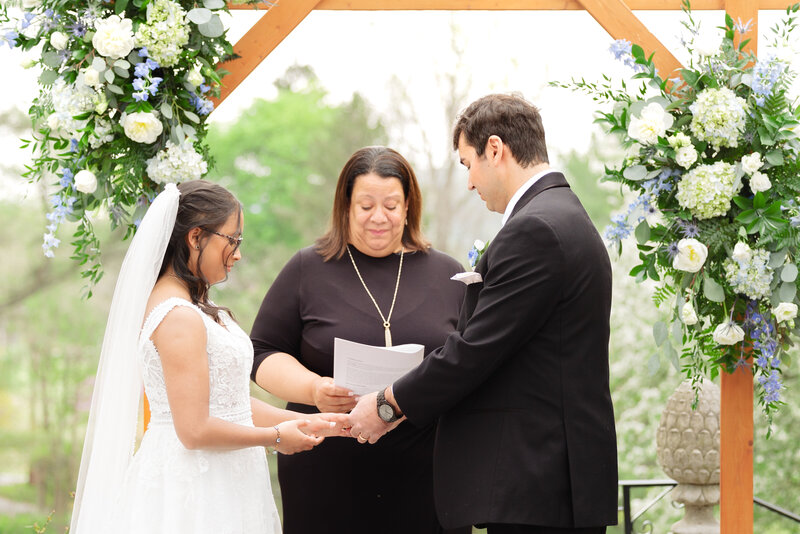 Gramercy Mansion wedding photographer takes photos of a ceremony in front of Gramercy mansion