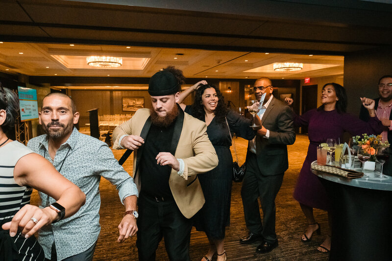 Guests dancing and enjoying the celebration at the Massachusetts State of Latino Education Gala in Boston, captured by Osa Igiede Photography.