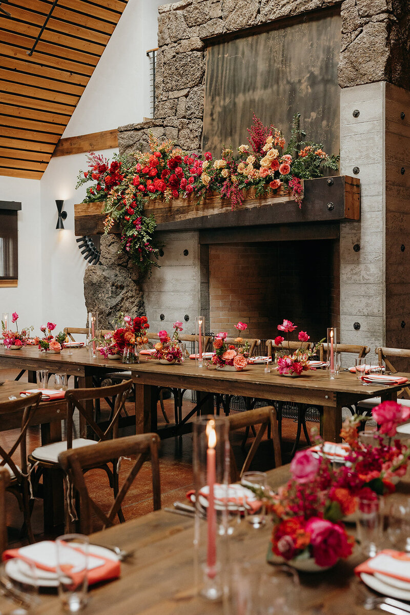 Fireplace floral installation with bold spring blooms