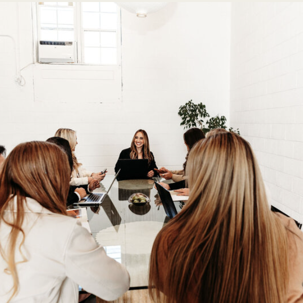 Visually appealing website design inspiration featuring a collaborative meeting of female entrepreneurs. This aesthetic image highlights a professional and engaging environment, ideal for websites showcasing marketing for women-owned businesses and impactful website design.