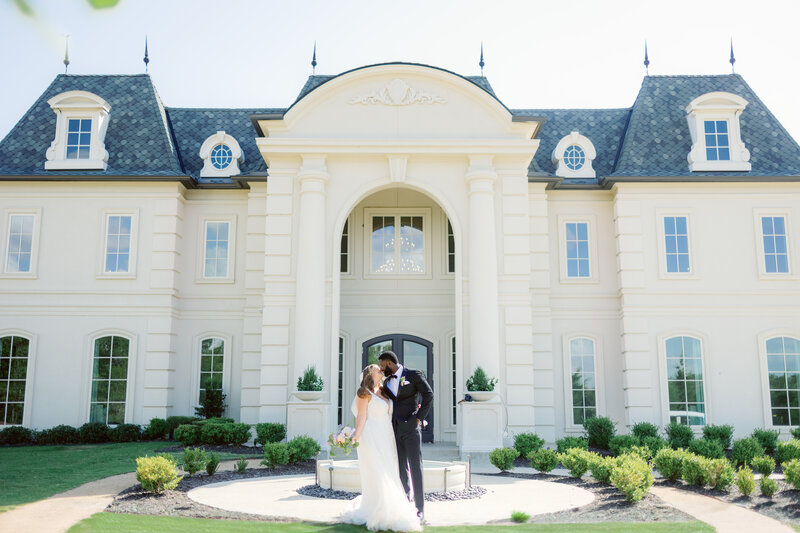 bride and groom outside of reception venue