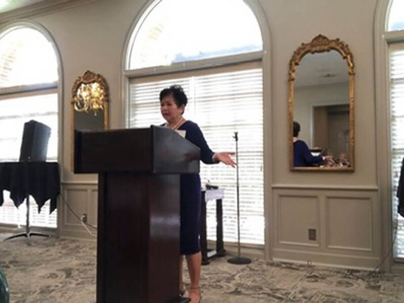 Nita Tin speaking at the 2023 Scenic City Women’s Network event in Chattanooga, sharing her message Christ My Hope about faith and encouragement in Christ.