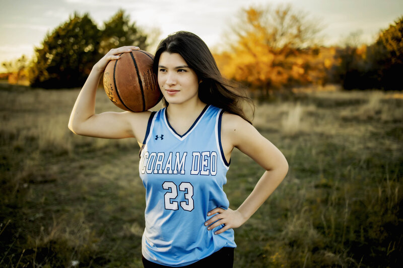 senior girl from Mckinney poses with basketball