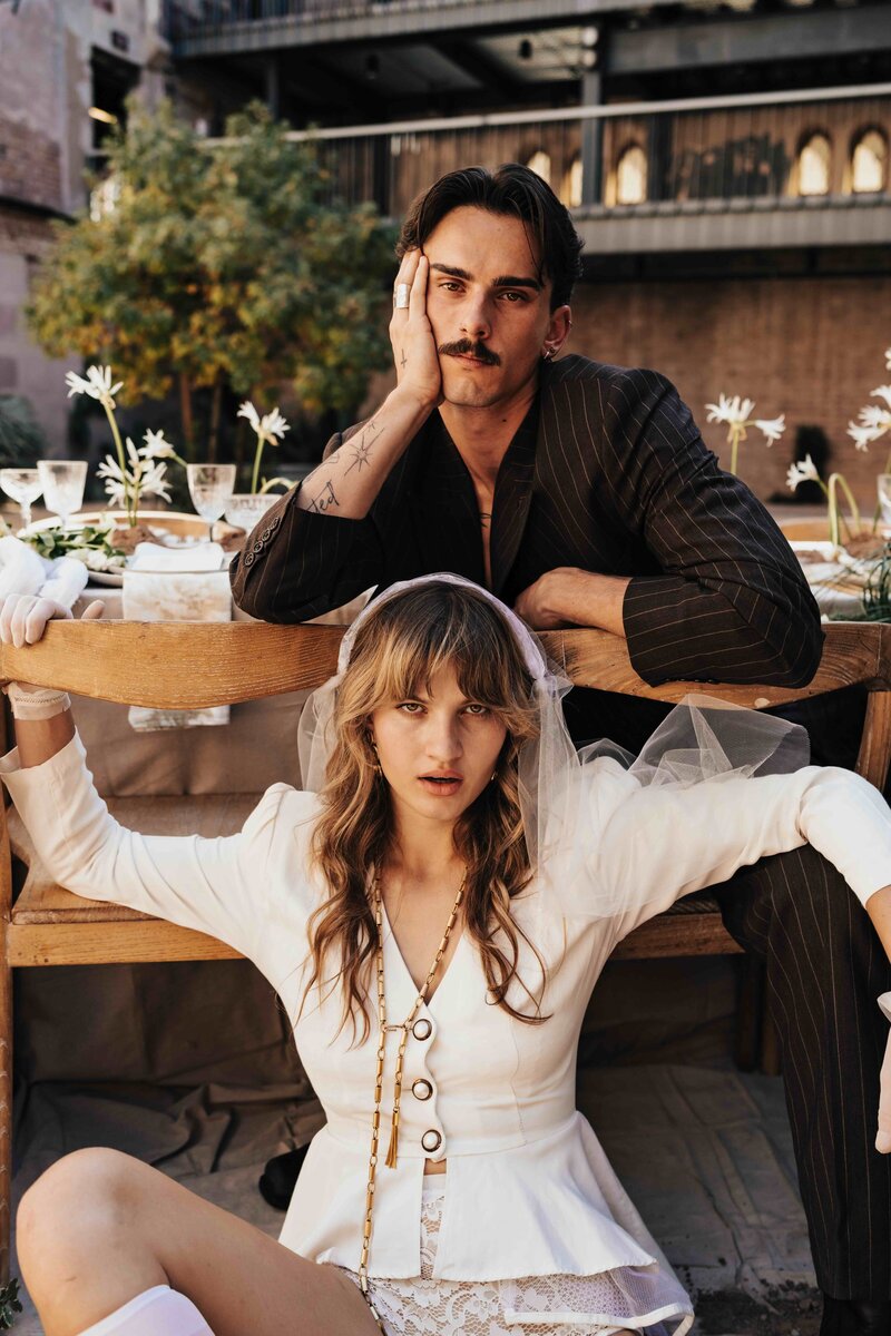 Future mother holding her belly in green house