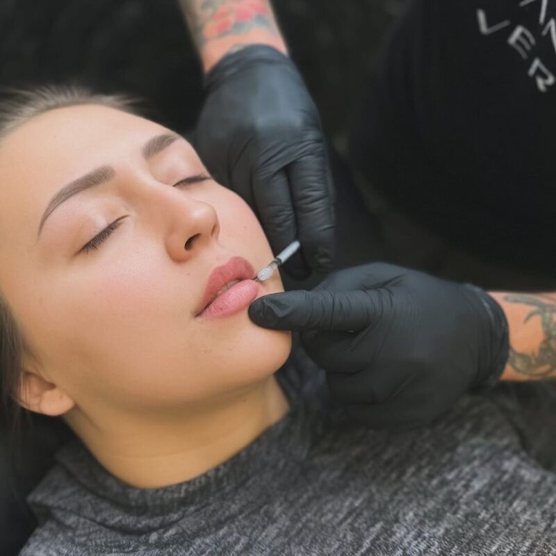 A woman getting lip injections at a medspa in CHandler, AZ.