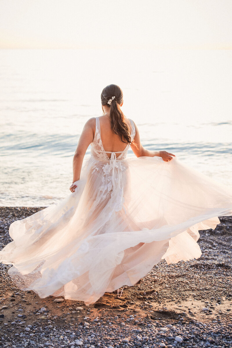 bride twirling dress on beach at camp kintail