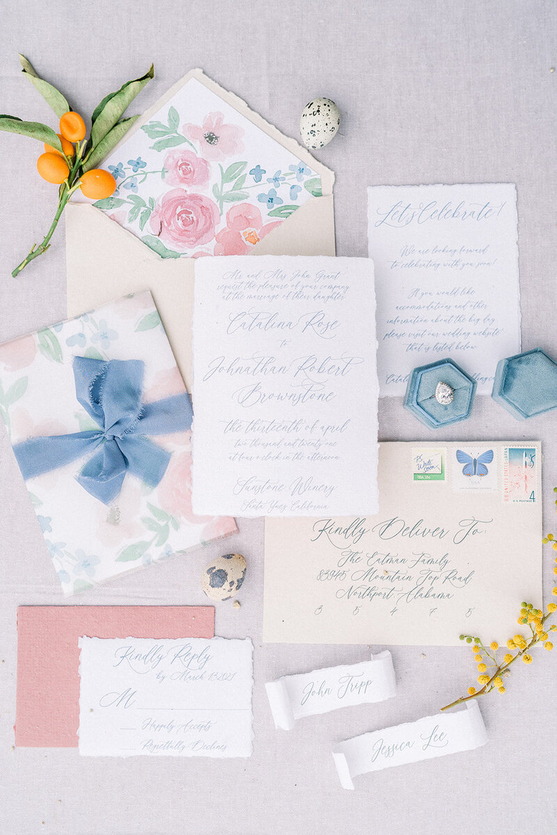 Tiffany Longeway Photography captures the exquisite details of wedding stationery designed for a celebration at Meadowood Napa Valley. The elegant calligraphy, soft pastel colors, and intricate floral designs reflect the sophisticated and luxurious atmosphere of this premier wedding venue, ideal for couples seeking an upscale and refined wedding experience.