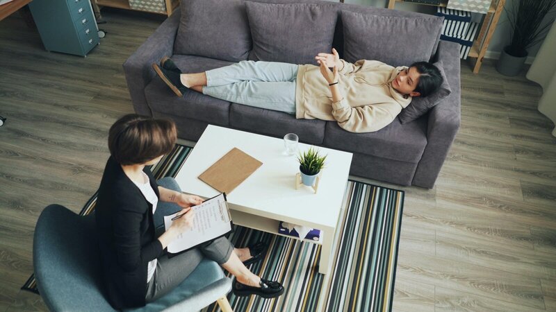 Therapist for perfectionism featuring two woman on couch.