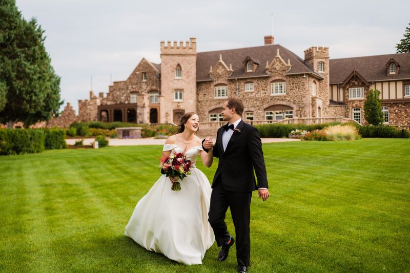 bride and groom in front of CO private estate wedding venue