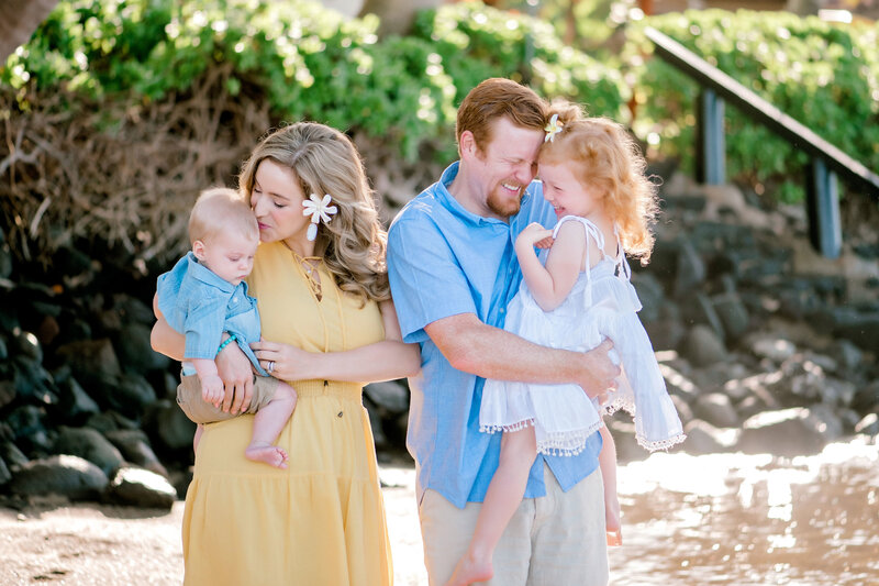A sweet family photo at Lahaina wearing calm colors was captured by Mariah Milan.