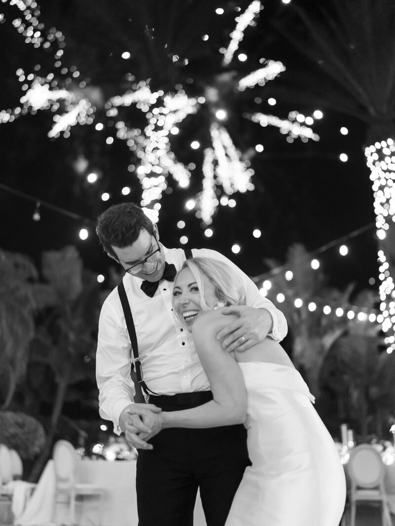 Outdoor Florida wedding bride and groom with fireworks at reception