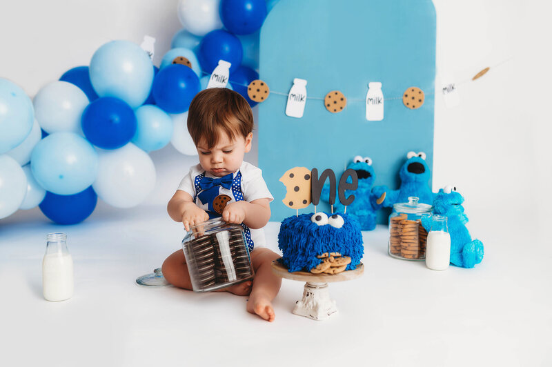 Baby explores a jar of oreo cookies during his First Birthday Photoshoot in Asheville, NC. 