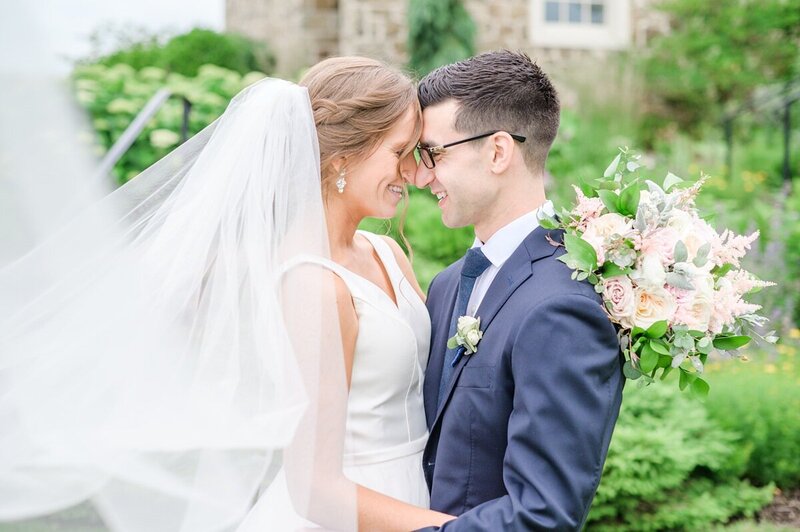 Couple embraces on wedding day photographed by Baltimore Maryland wedding photographer Cait Kramer