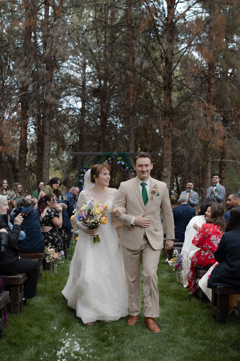 Jovanna G Photography. Classic, sophisticated Wedding Photos. Soft romantic engagement photos. Soft romantic WeddingPhotos. Sophisticated Wedding Photographer. Professional Wedding Photographer. Destination Wedding Photographer. Luxury Wedding photographer. Traveling Wedding Photographer. AZ Wedding Photographer. Gilbert AZ Wedding Photographer. Queen Creek Wedding Photographer. Phoenix Wedding Photographer. Scottsdale Wedding Photographer. Flagstaff Wedding Photographer. SoCal Wedding Photographer. California Wedding Photographer. Northern California Wedding Photographer. Southern California Wedding Photographer. San Francisco Wedding Photographer. Bay Area Wedding Photographer. San Jose Wedding Photographer. Golden Gate Bridge Wedding Photographer. Beach Lover Wedding Photographer. Palace of the Fine Arts Wedding Photographer. Ocean Lover. I love California. Orange County Wedding Photographer. Newport Beach Couples Photographer. Newport Beach Wedding Photographer. Laguna Beach Couples Beach Engagement Photographer. Laguna Beach wedding beach photographer. Los Angeles Wedding Photographer. Young and in love engaged couples who live in southern California. Christian Young Couple. Young Engaged Couple. Engaged High School Christian Couple. Christian Values. Young conservative Christian women. Young Conservative Christian men. Young Conservative Christian Couple. Young Christian Couple Engaged in High School. Young Christian College Couple. Forest, Flora Wedding for the Fergusons. Arizona Flagstaff Wedding. Arizona Flagstaff Wedding Cloudy, Rainy day. Detail Flatlays. Details Checklist. Vow books. Ring box. Jewelry. Florals. Groom’s Details. Hunter and Julia Forest pine tree wedding. Pine Top Cloudy Rainy day Wedding day. Pine tree mountain wedding. California pine mountain tree wedding day. Outdoor rainy day wedding in the mountains. Mountain top pine tree outdoor spring wedding. Green bridesmaids dresses. Fun wedding party. Venue at Schnepf Farms. Wild Blume Florals. Makeup by Laly Harr. David’s Bridal. Womack Services AZ. Inspired Sugar Cake.