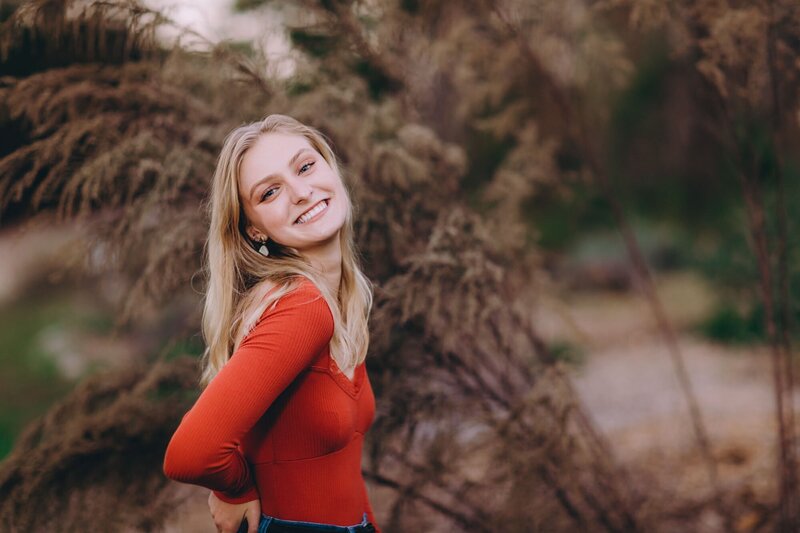 Happy girl smiling for her senior portrait in Peachtree City, Georgia.