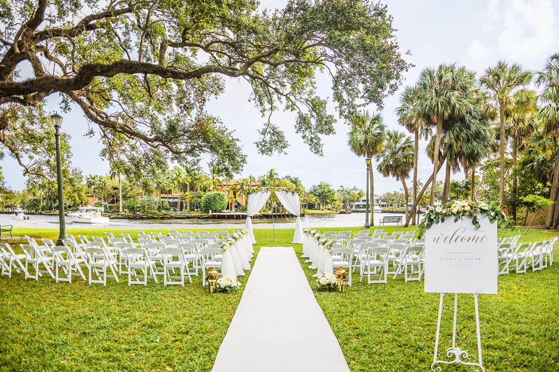 Elegant outdoor wedding ceremony setup at Colee Hammock Park in Fort Lauderdale, photographed before guests arrive as part of the no-first-look wedding timeline.