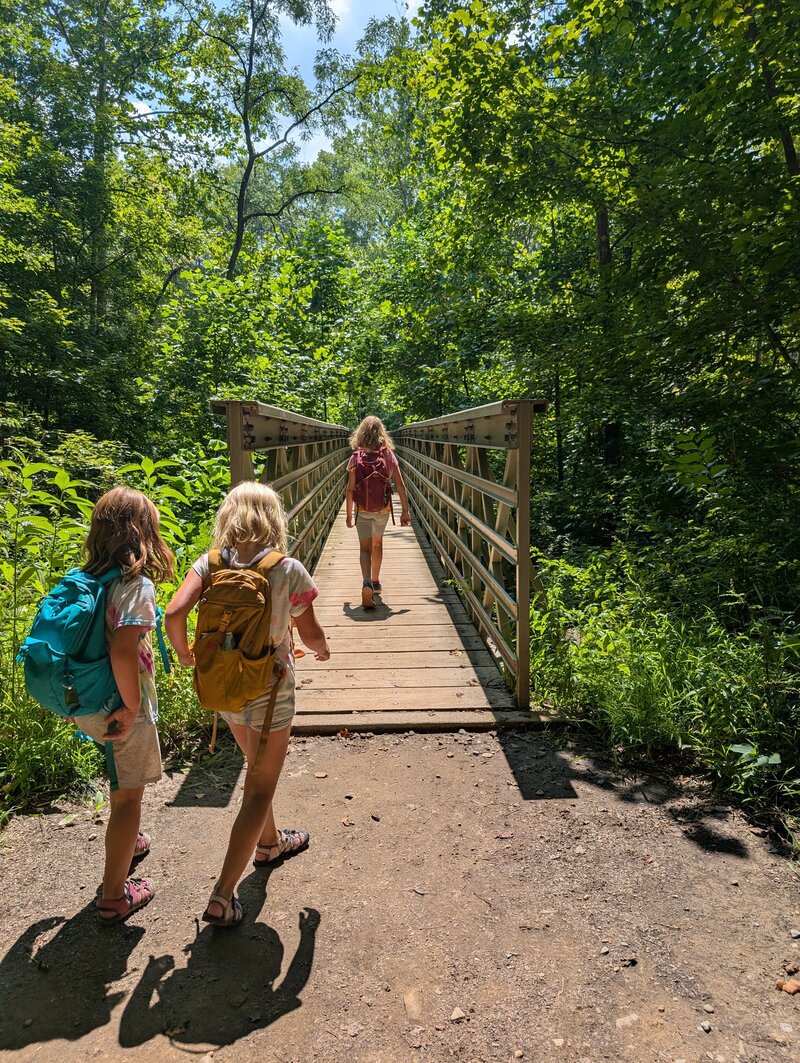 Julie Pokorny lifting her 6 year old above her head as they play outside in Baltimore , Maryland. Represents strength, play, and happiness. 