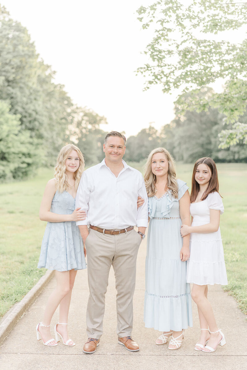 family of 4 posing for photos during Chantilly, Virginia spring mini session