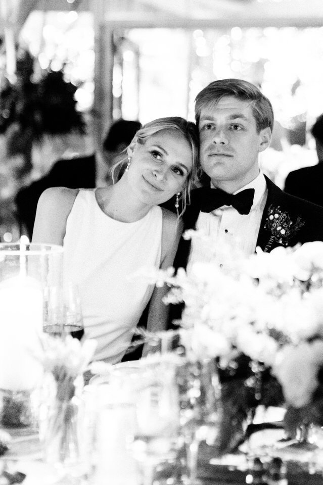 black and white reception photo of a bride and groom