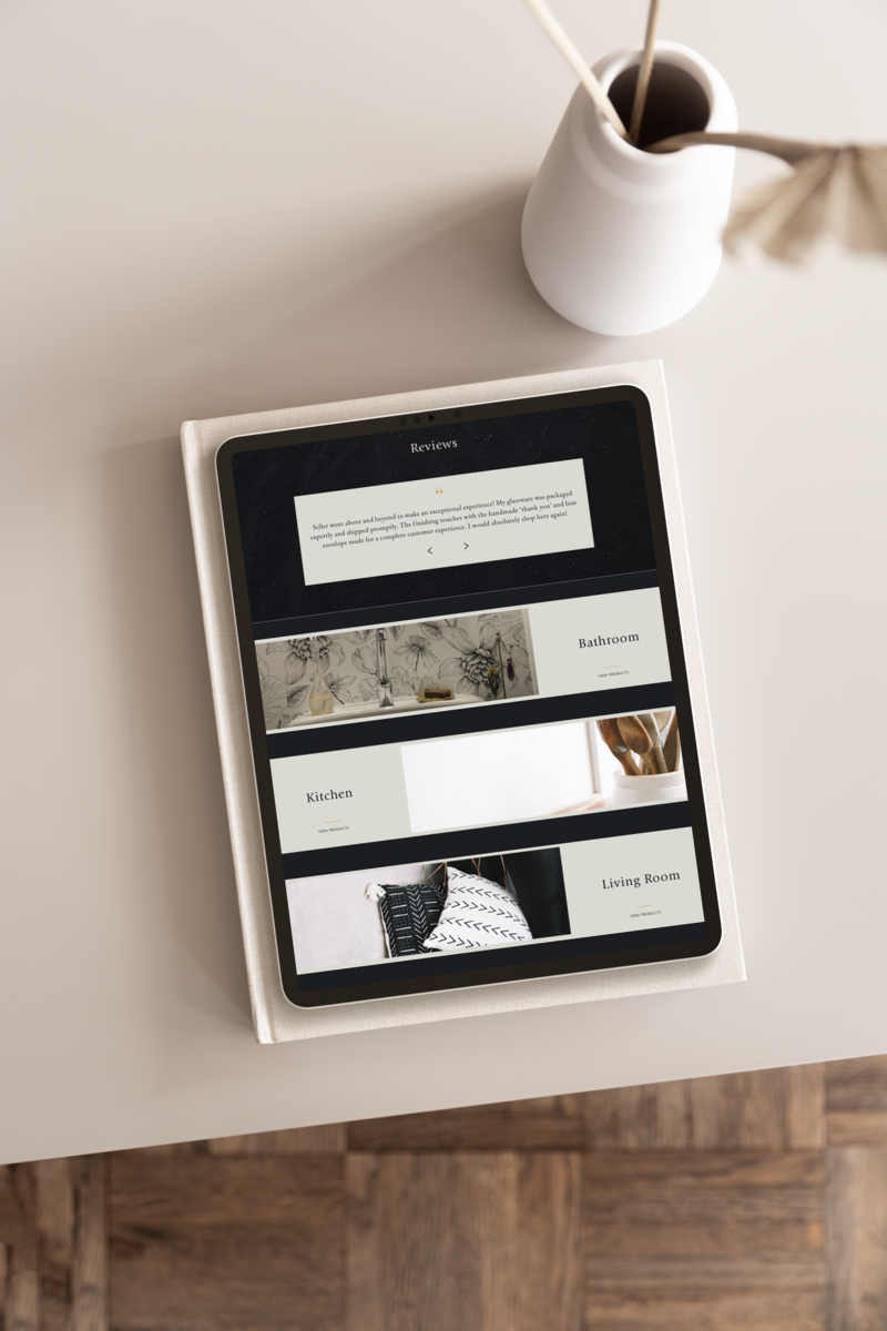 Home page of a website for an interior design e-commerce store with a dark moody background