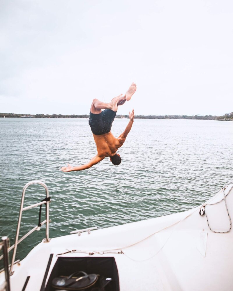 Young man dive into the see
