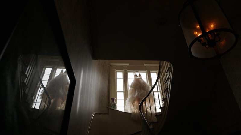 A wedding dress handing in window