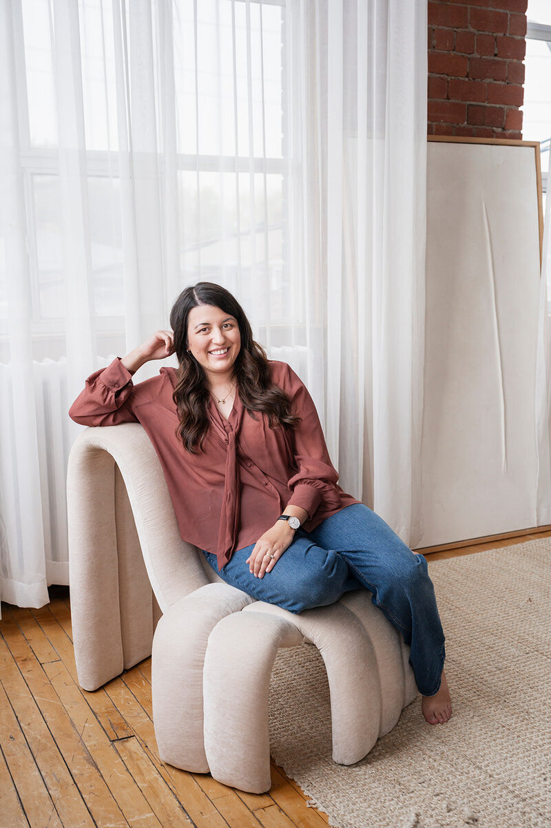 brand and marketing director Ashley Wyatt on laptop