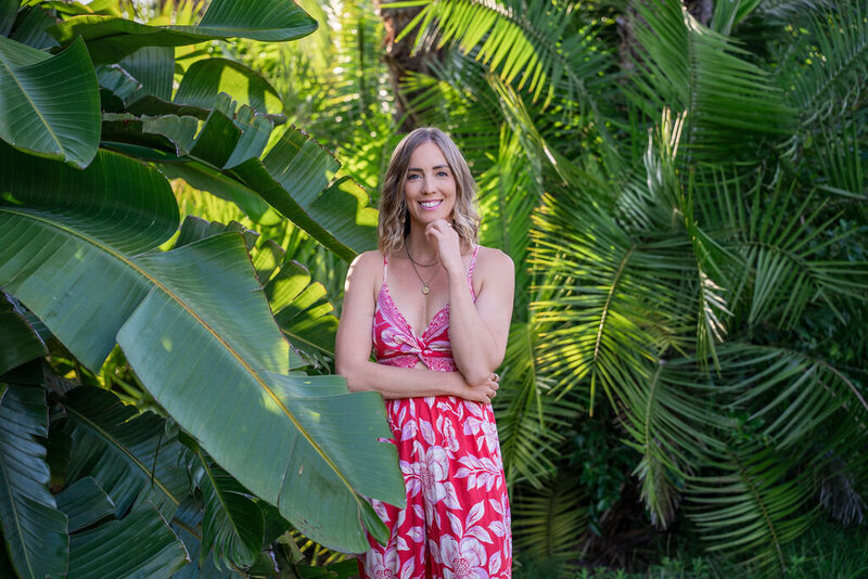 The designer, Micaela, standing in the botanical gardens in San Diego, California