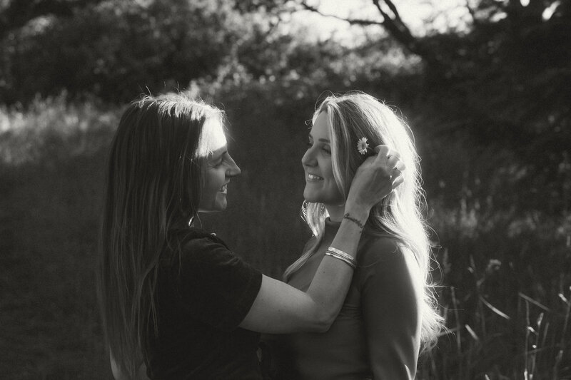 Intimate moment between a couple during their portrait session on Vancouver Island, photographed by Rae Terrillon.