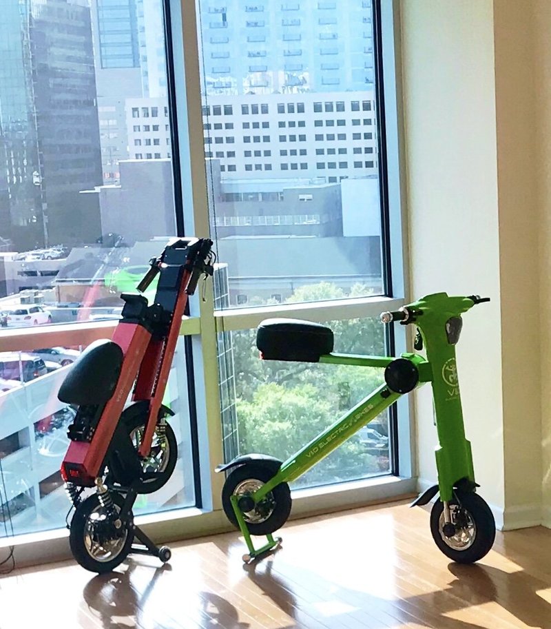 Green Go-Bike M1 & Red Go-Bike M2 folded up in apartment building