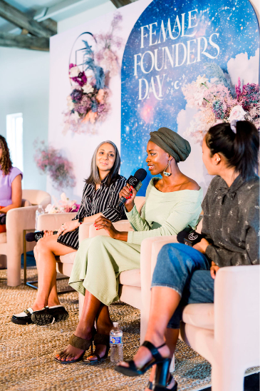 Female Founders Day panel styled with ethereal corporate floral arrangements, celebrating women-led innovation in Austin.