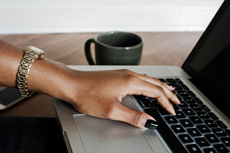 black-woman-hand-on-laptop-createherstock-e1556633220771-2