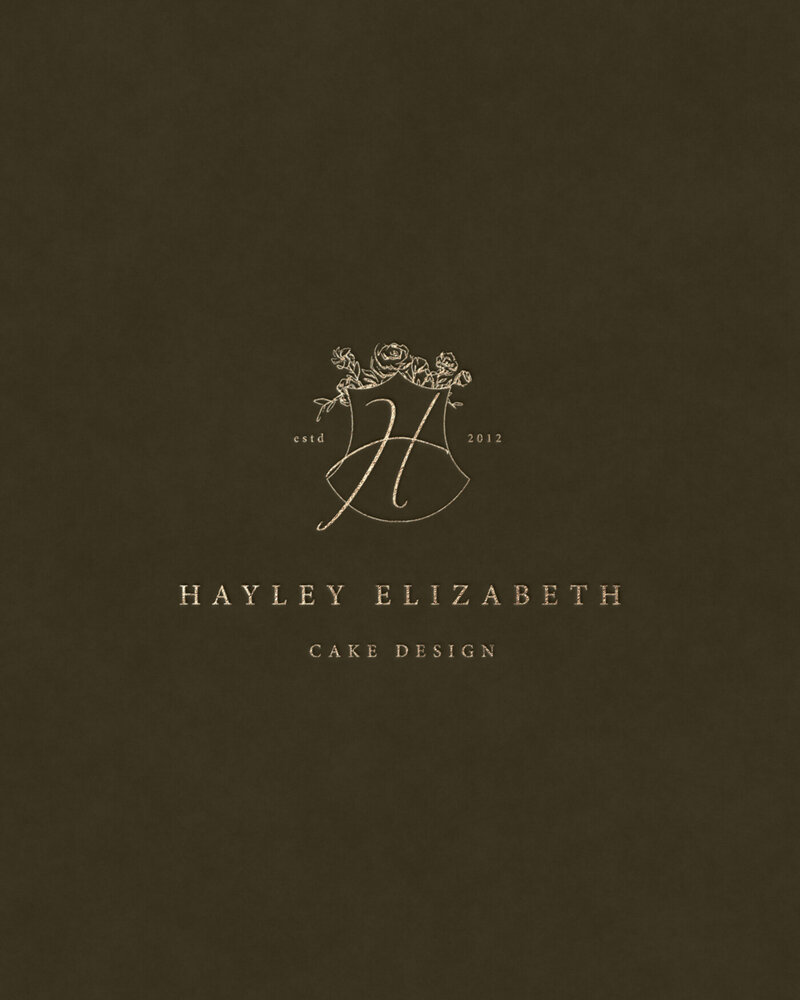 Forest green textured background featuring Hayley Elizabeth’s gold logo design