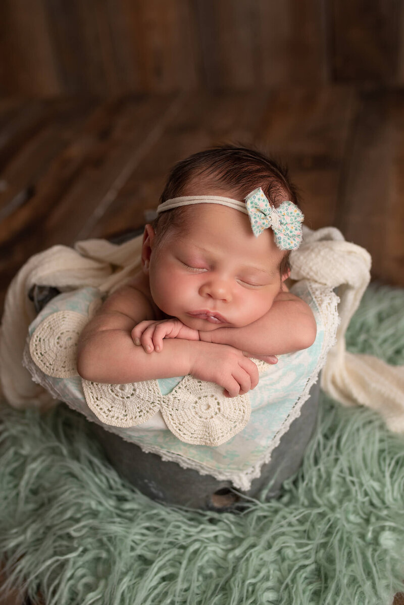 Milwaukee Newborn Photo baby posed in bucket in studio | Glory Be Photography by Tara Bos
