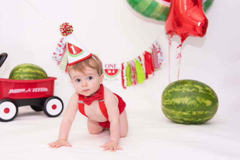 A one-year-old at his cake smash photo session.