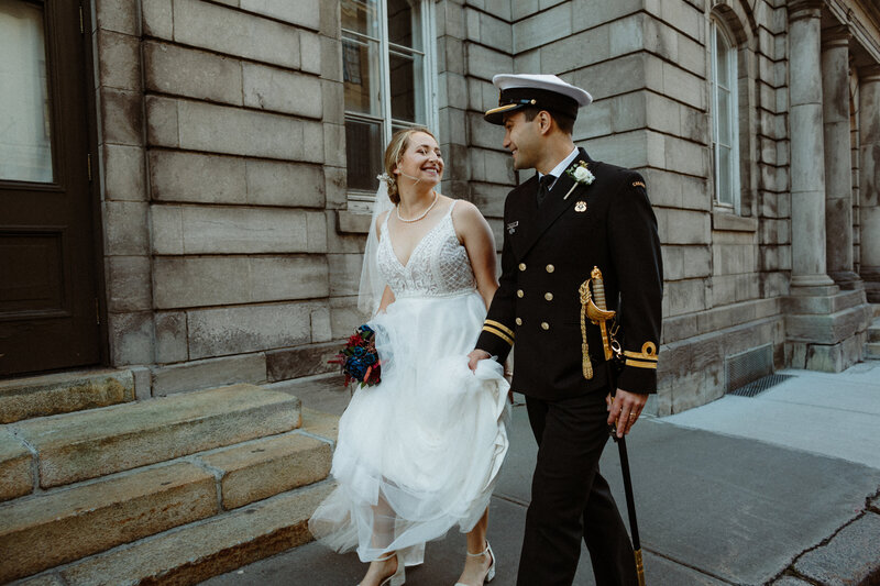 newlywed couple walking the streets of old quebec city