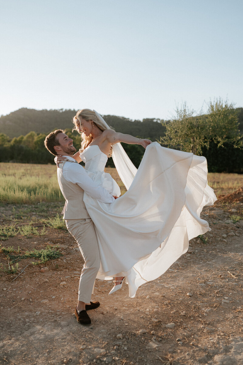 Bride and groom share quiet sunset moment during Norfolk wedding