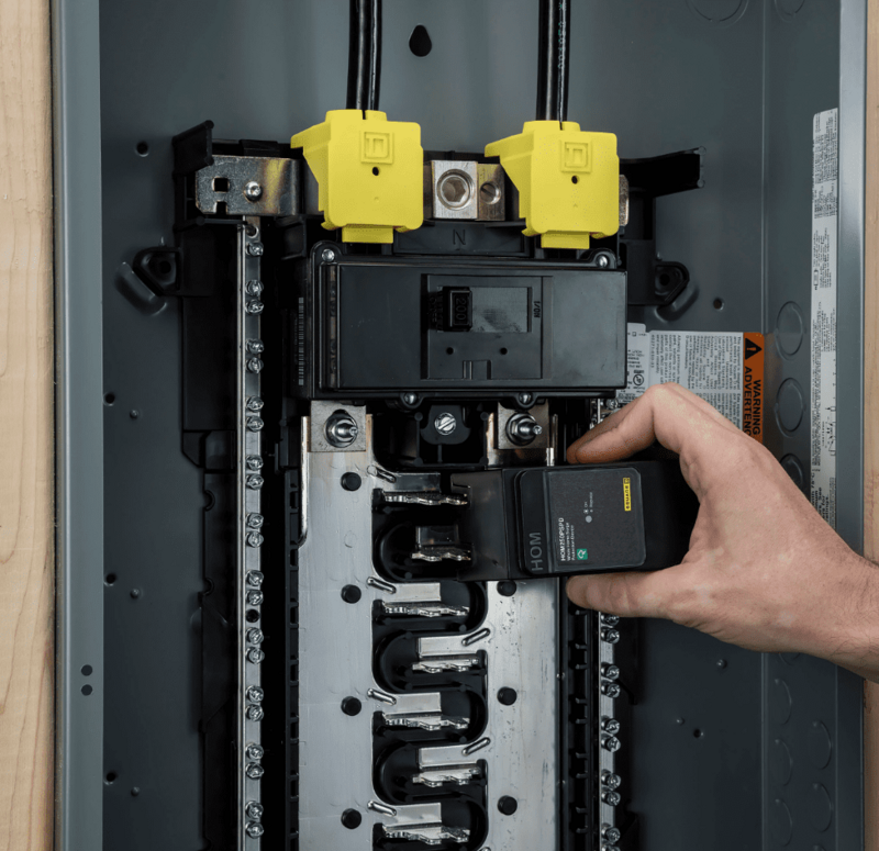 Electrician in Albuquerque installing surge protection
