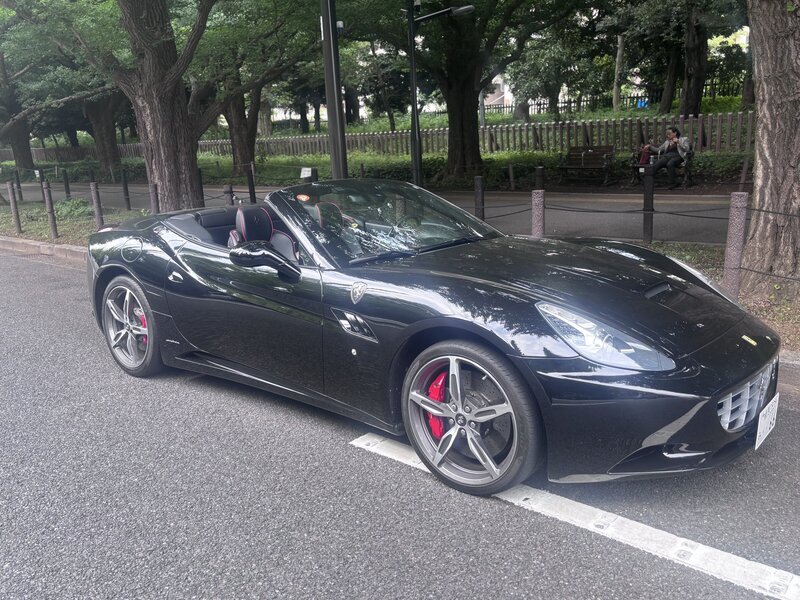 Black Ferrari parked in Tokyo 
